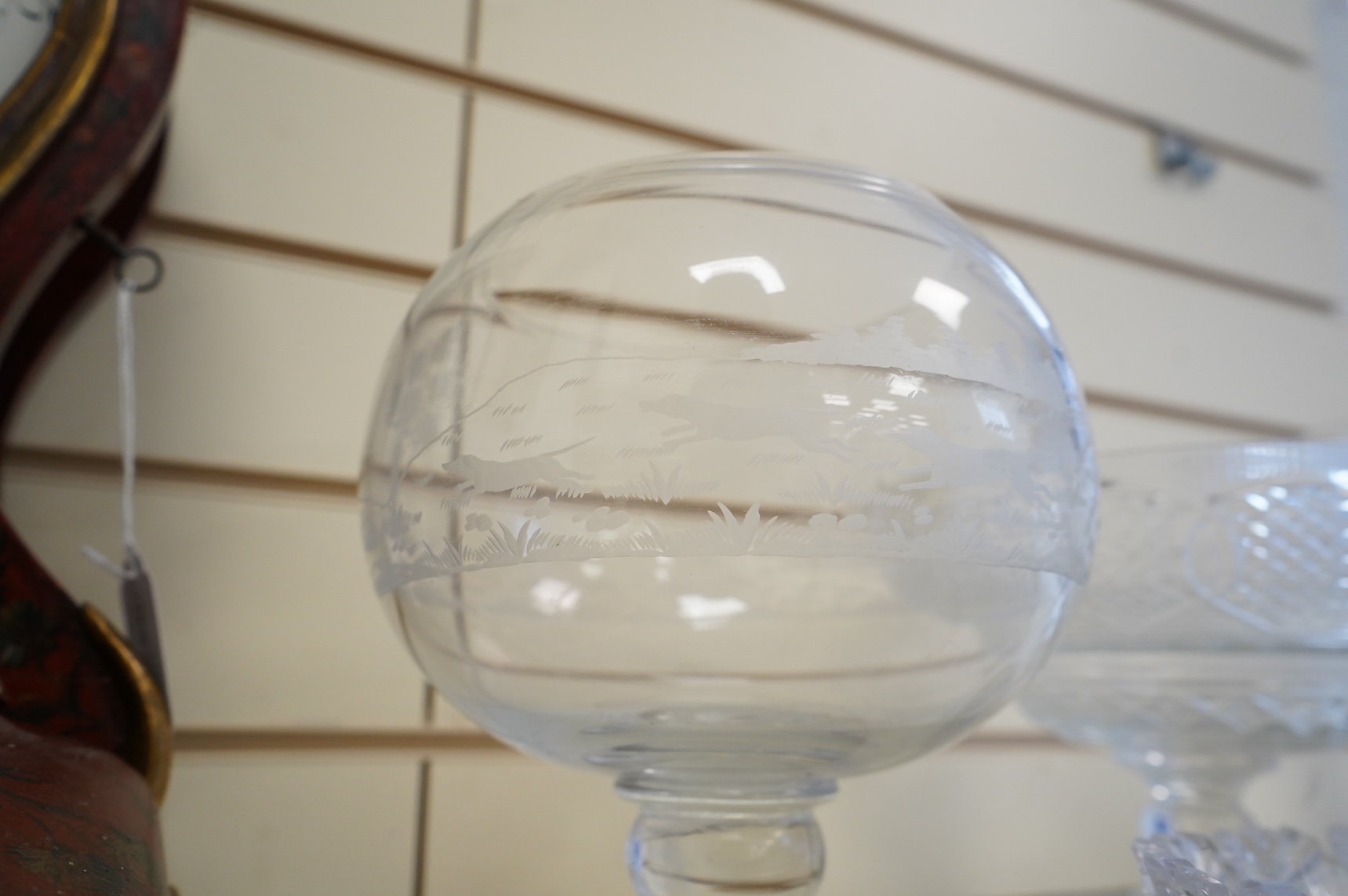 Two footed glass bowls engraved with racing and hunting scenes, an early 19th century oval cut glass fruit bowl, another, modern, together with a small Regency mallet shaped decanter, with an enamel label ‘’Whisky’’, (6)